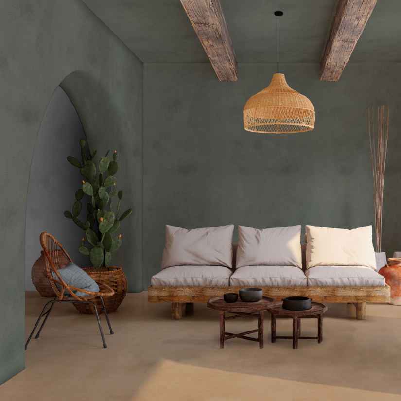 Living moderno con pareti in microcemento Micro Supreme color verde e pavimento effetto naturale, arredamento rustico ed elegante.